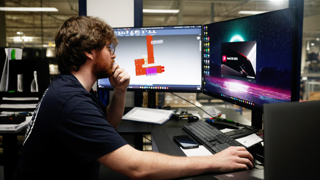 Engineer reviewing a design on screen